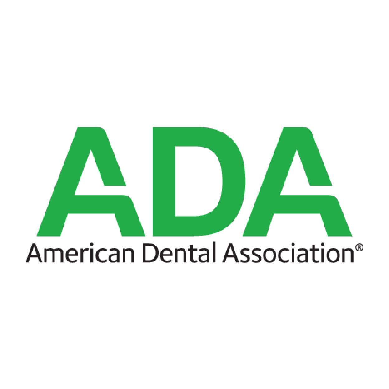 The logo for the american dental association is green and white.