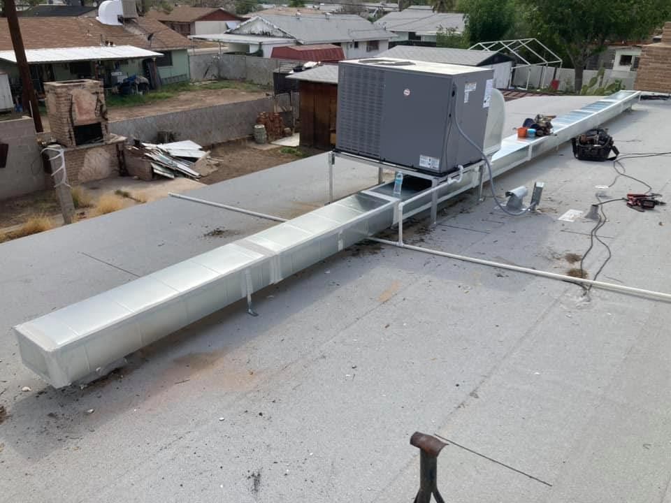 The roof of a building with a ventilation system on it
