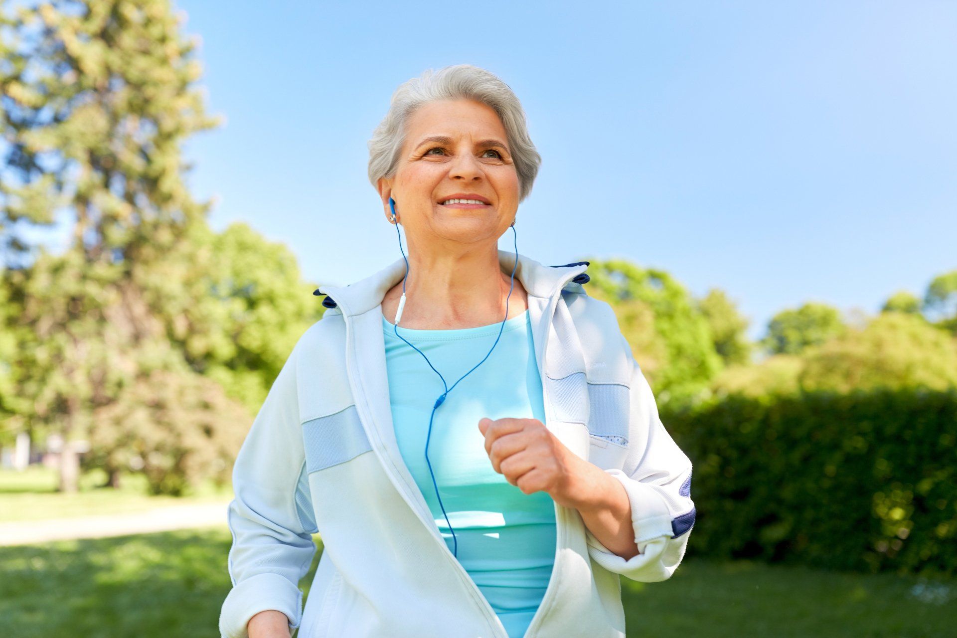 elderly woman jogging outdoors