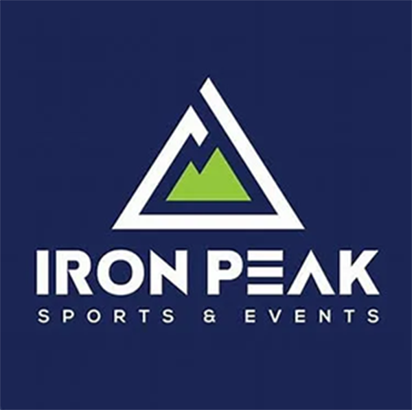 Logo of Iron Peak Sports & Events. White triangle with green mountain on navy blue background. White text reads “Iron Peak” and “Sports & Events”.