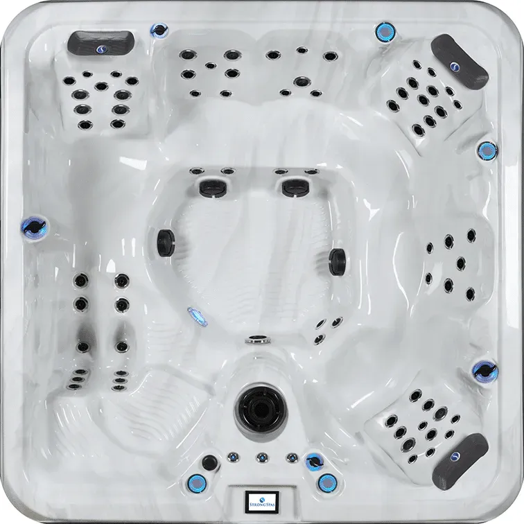 White hot tub with multiple black jets and gray headrests, viewed from above.
