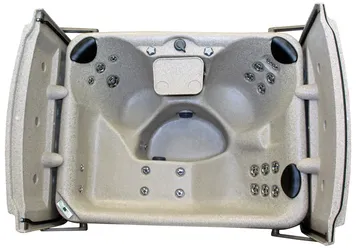 Open gray upholstered folding seat with armrests and cup holders, viewed from above