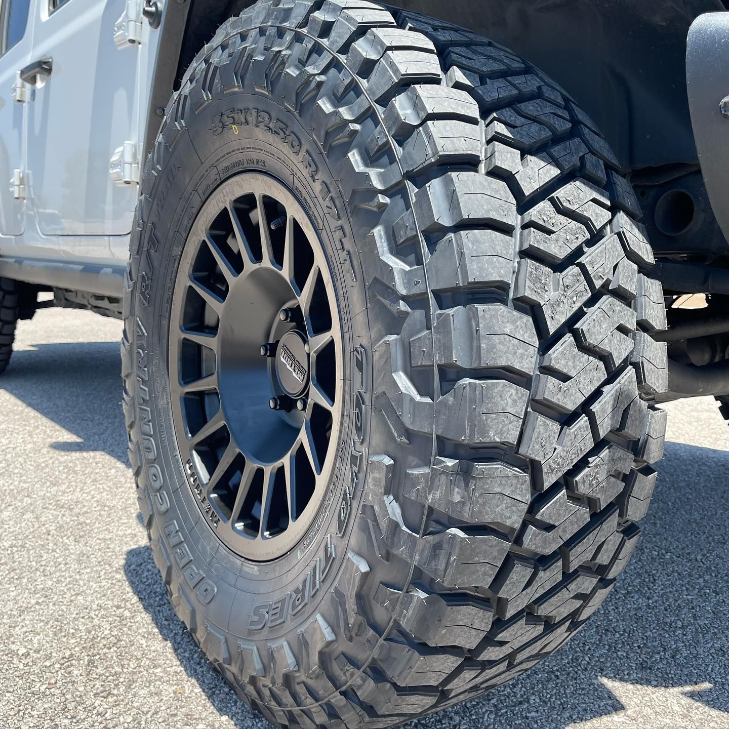 A close up of a tire on a jeep.