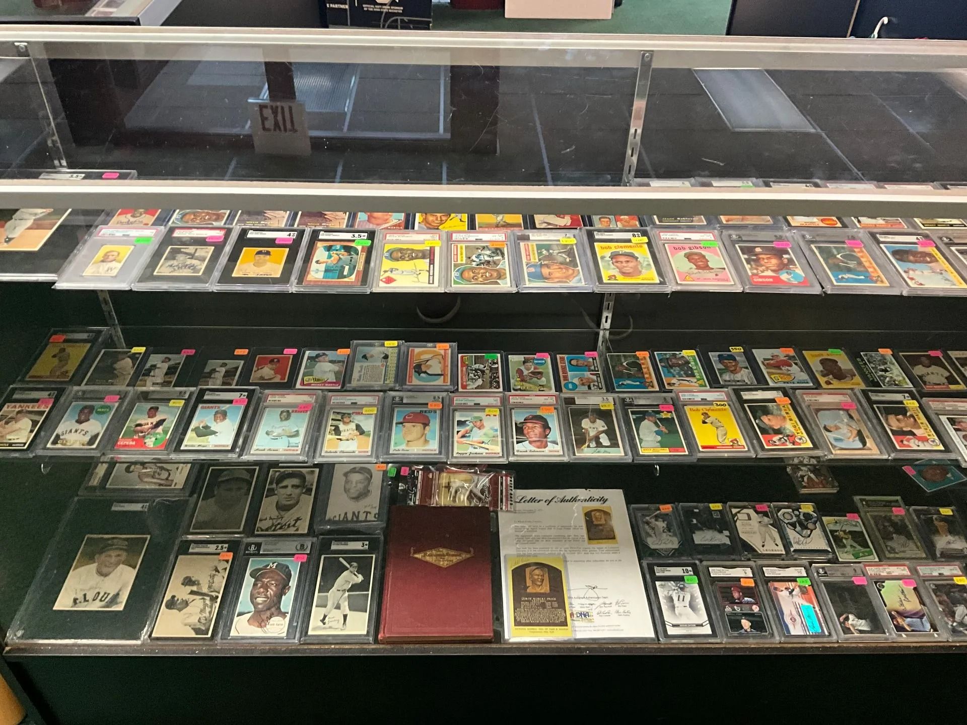 Display case filled with baseball cards for sale.
