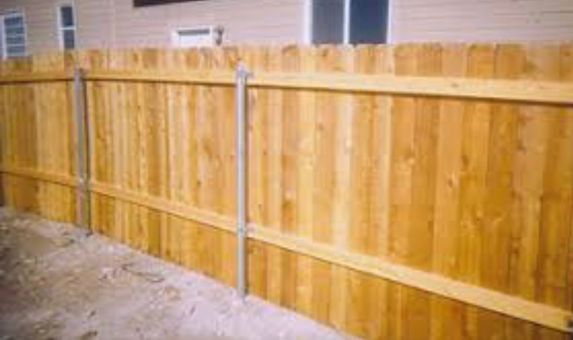 A wooden fence around the house.