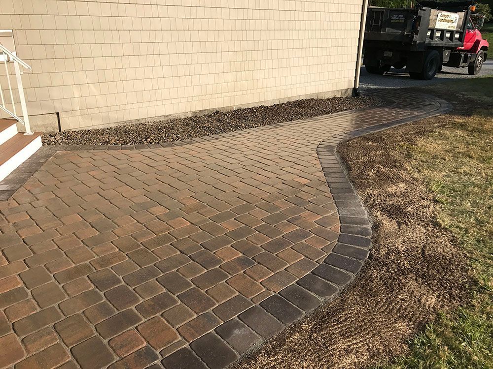 Brown concrete walkway.