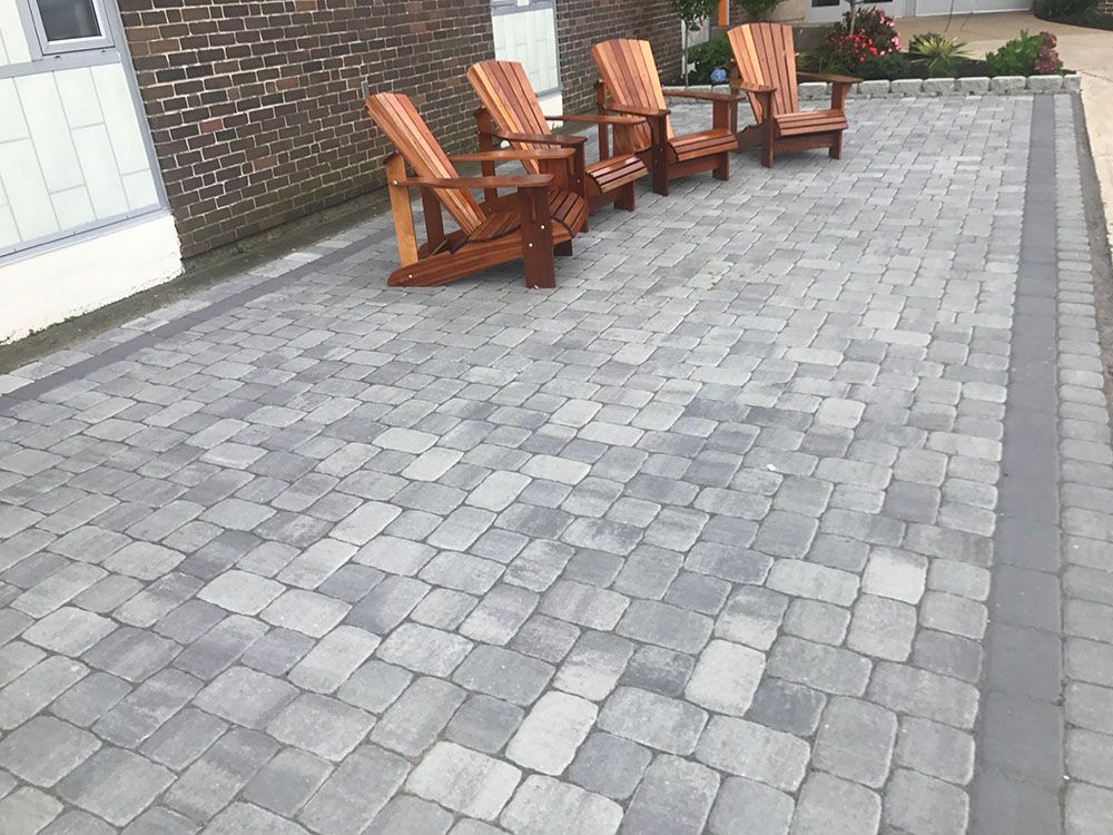 Concrete driveway and wood chairs.