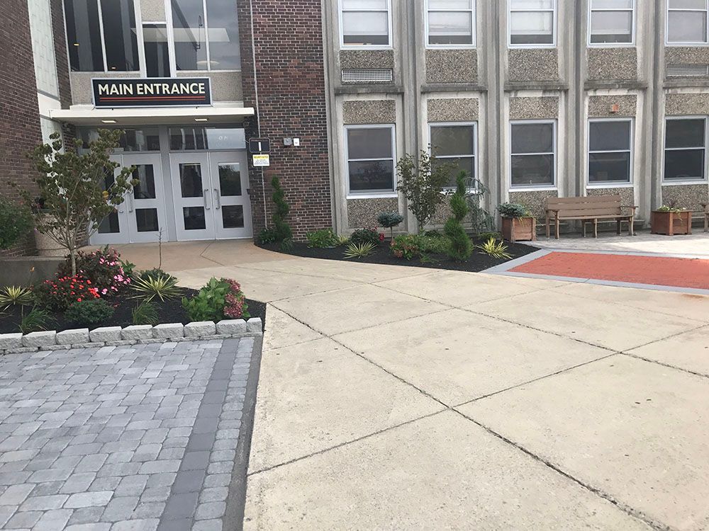 Building with concrete driveway.