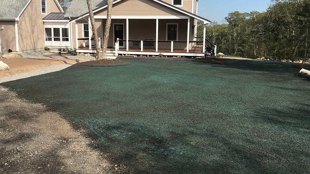 House with gravel driveway.
