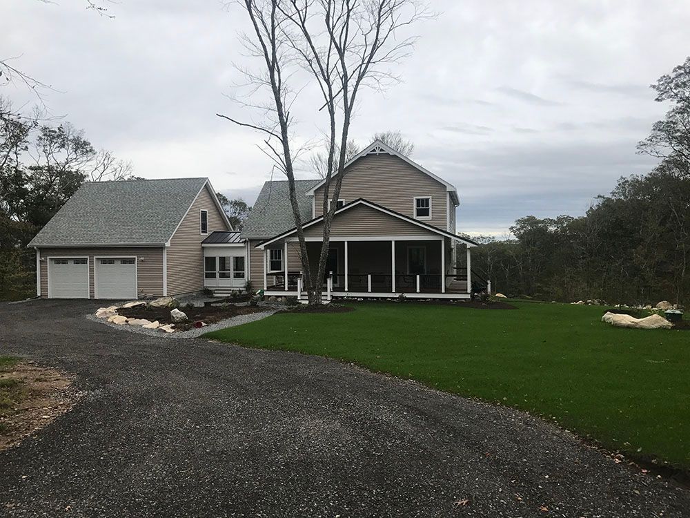 House with gravel driveway.
