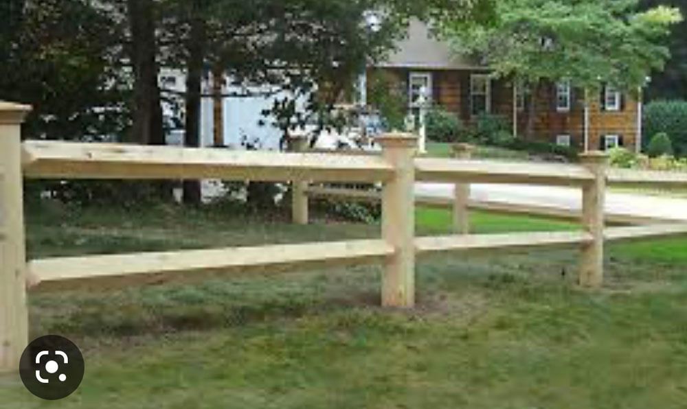 House with yellow fence.