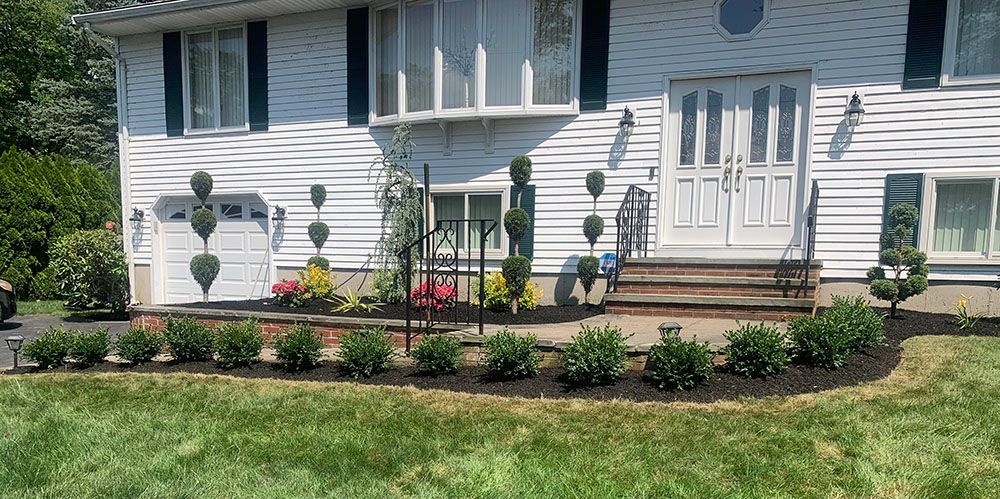 White house with garden.