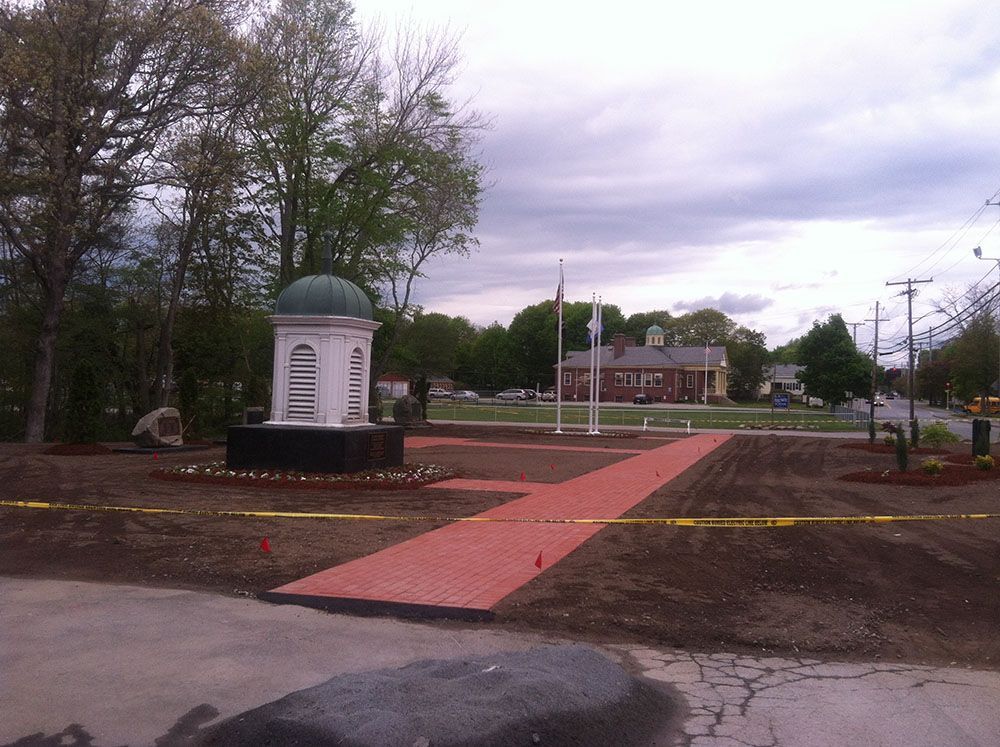 A red brick sidewalk with a white dome in the middle, creating a striking contrast in colors and textures.