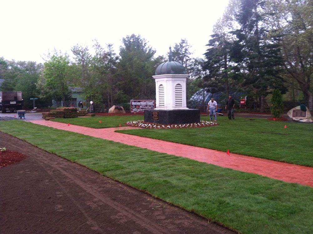 A park surrounded by greenery and flowers.