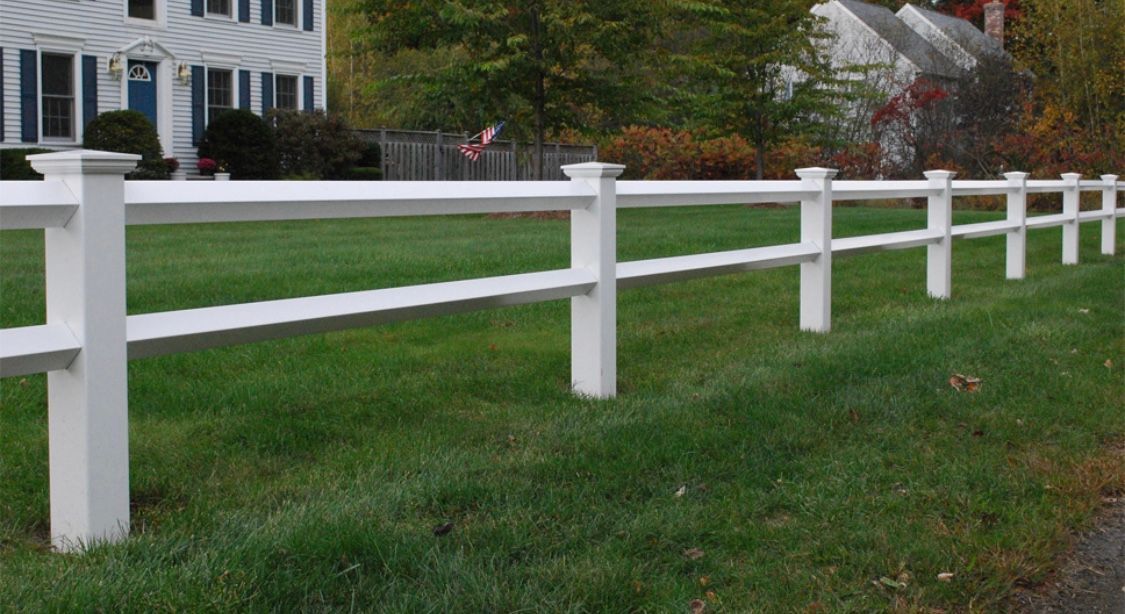 A white fence, providing security and privacy to the enclosed area.
