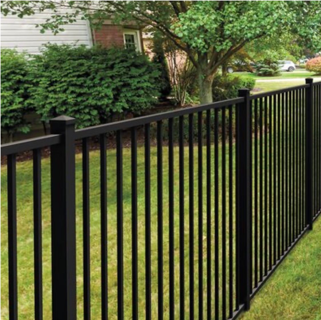 A steel black fence, providing security and privacy to the enclosed area.