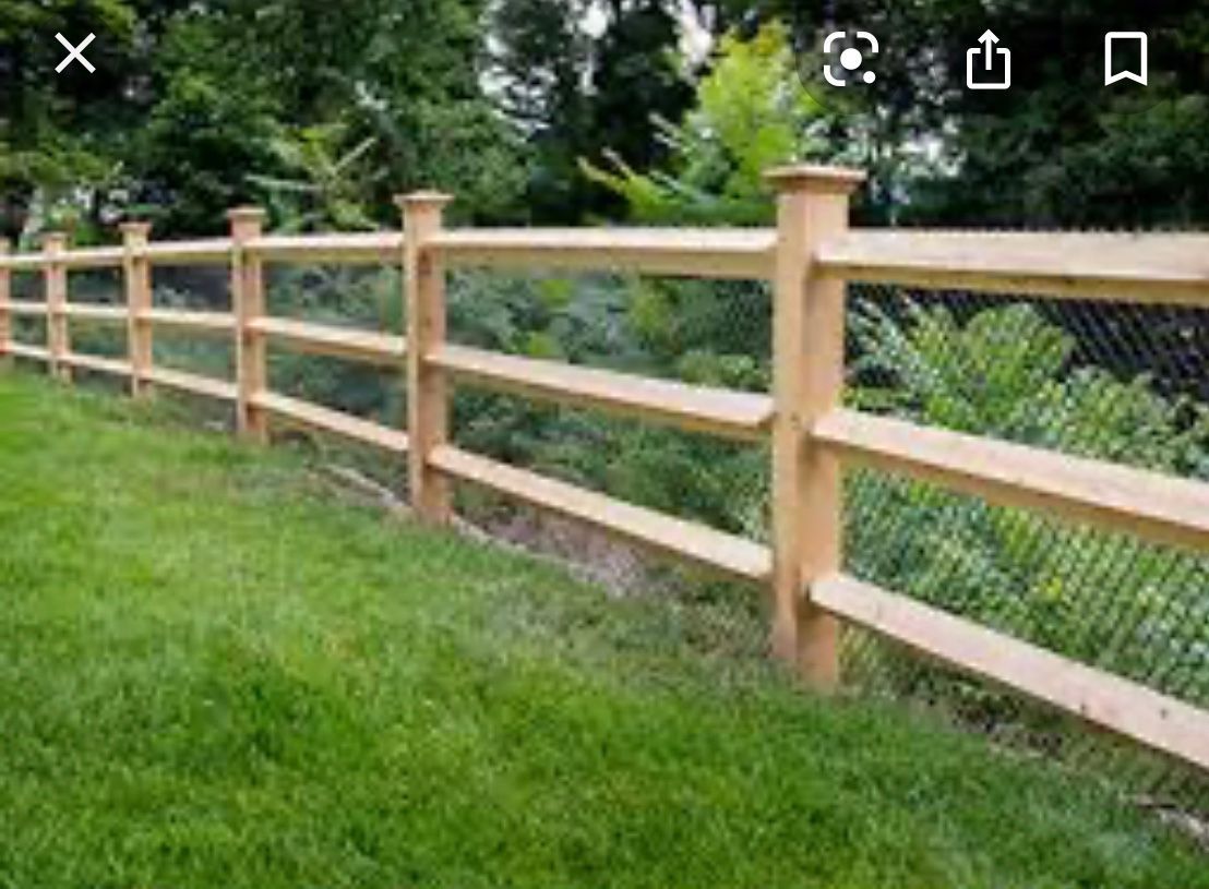 A wooden fence, providing security and privacy to the enclosed area.
