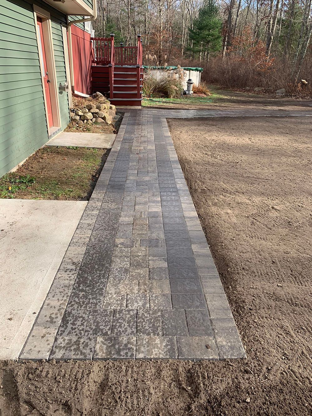 Concrete path leading to a house.