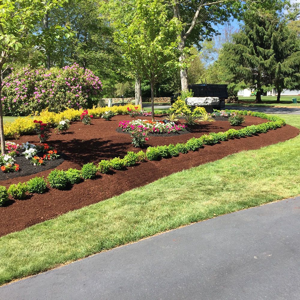 A landscaping design featuring colorful flower beds.