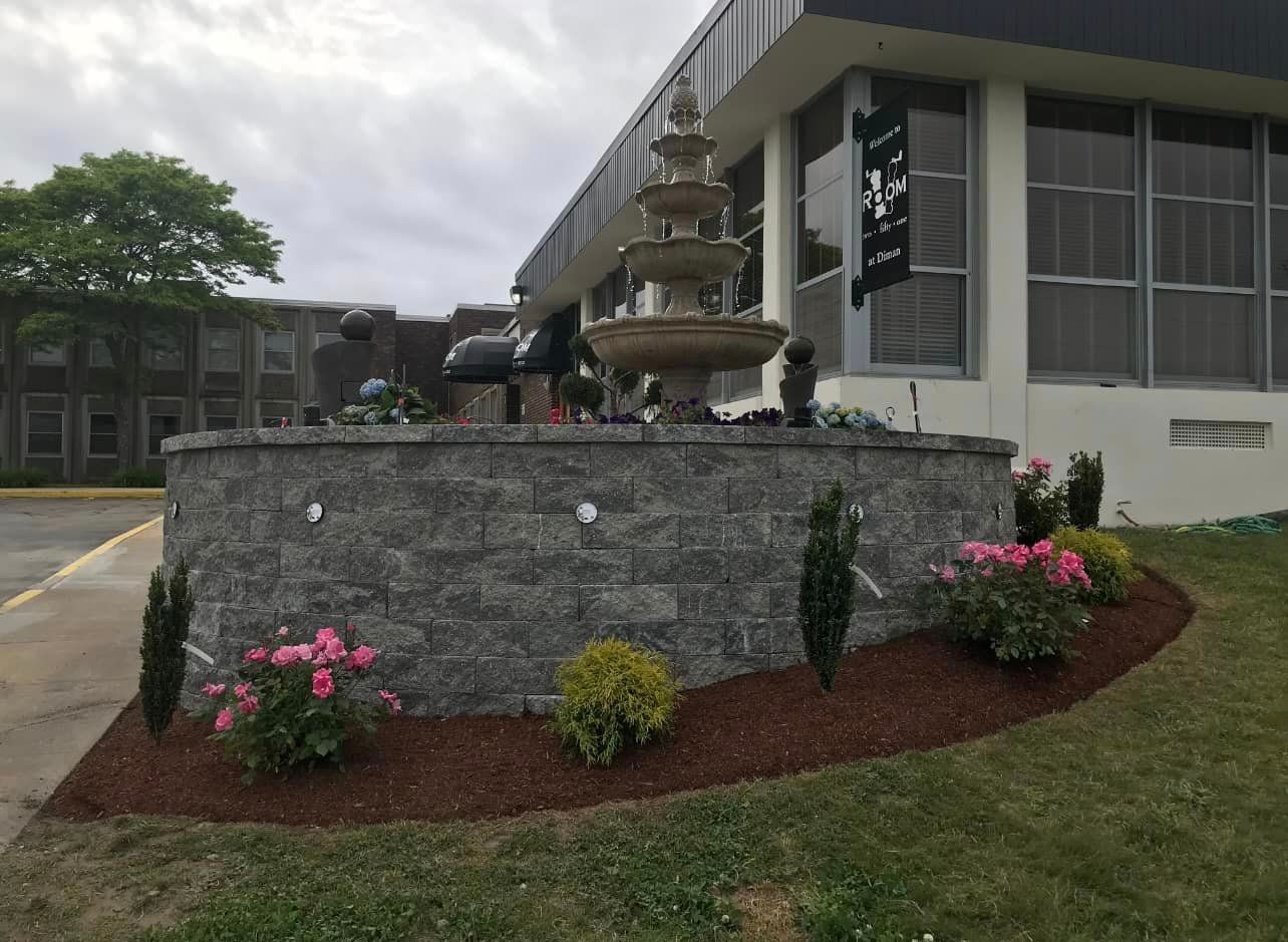 a large building with a fountain in front of it