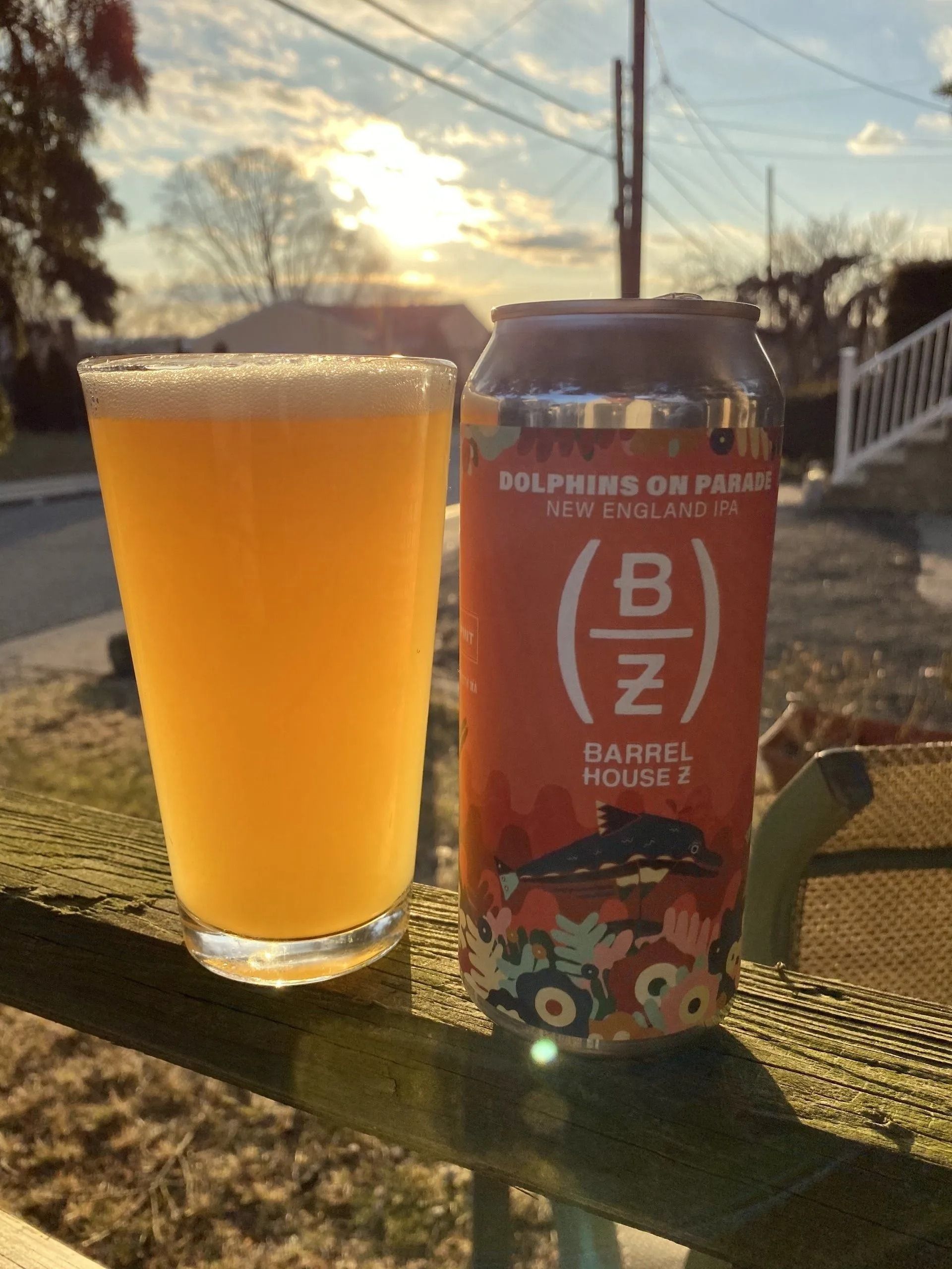 A glass and can of beer, labeled