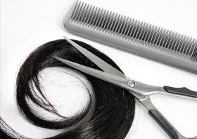 Black hair and hairdresser's tools