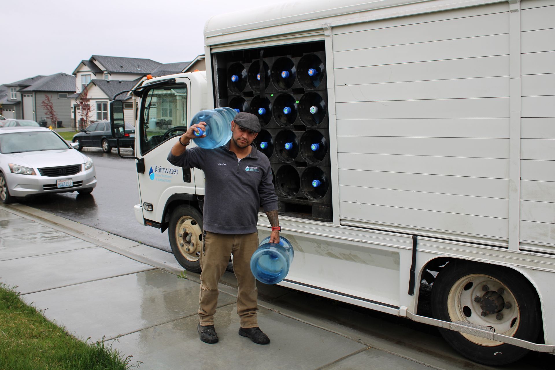 Employee carrying out bottles of water