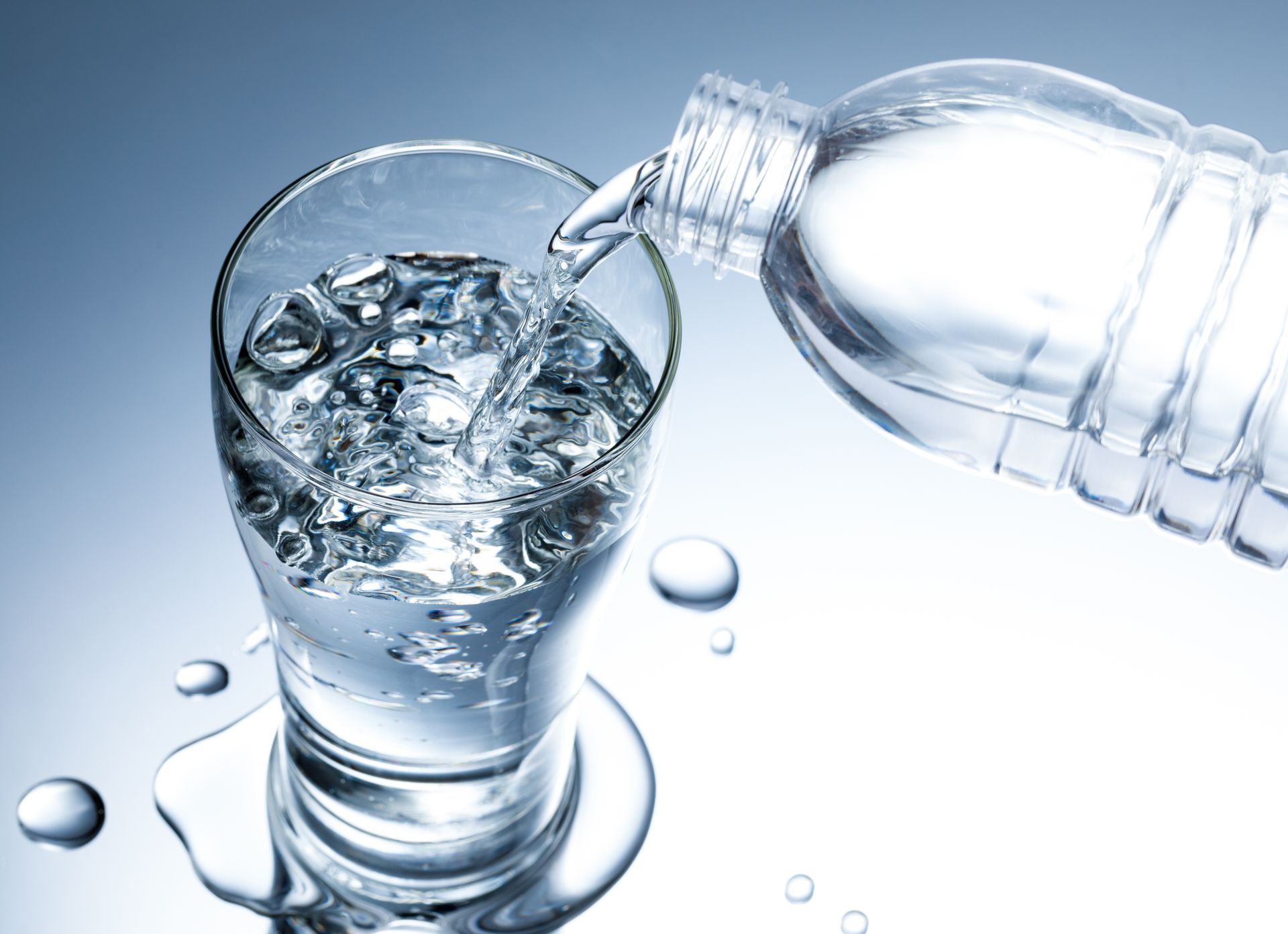 photo of water being poured into a glass