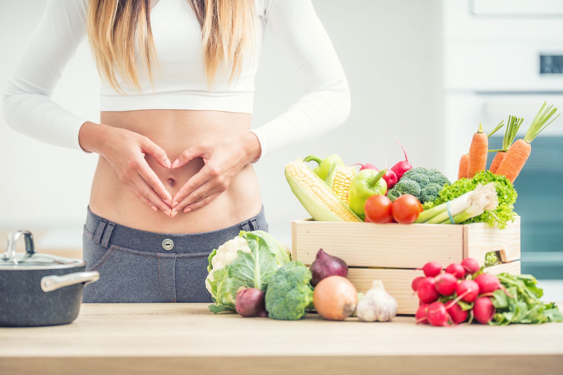 woman with healthy digestive system and fruits and veggies