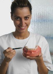 Woman Holding a Teeth Sample