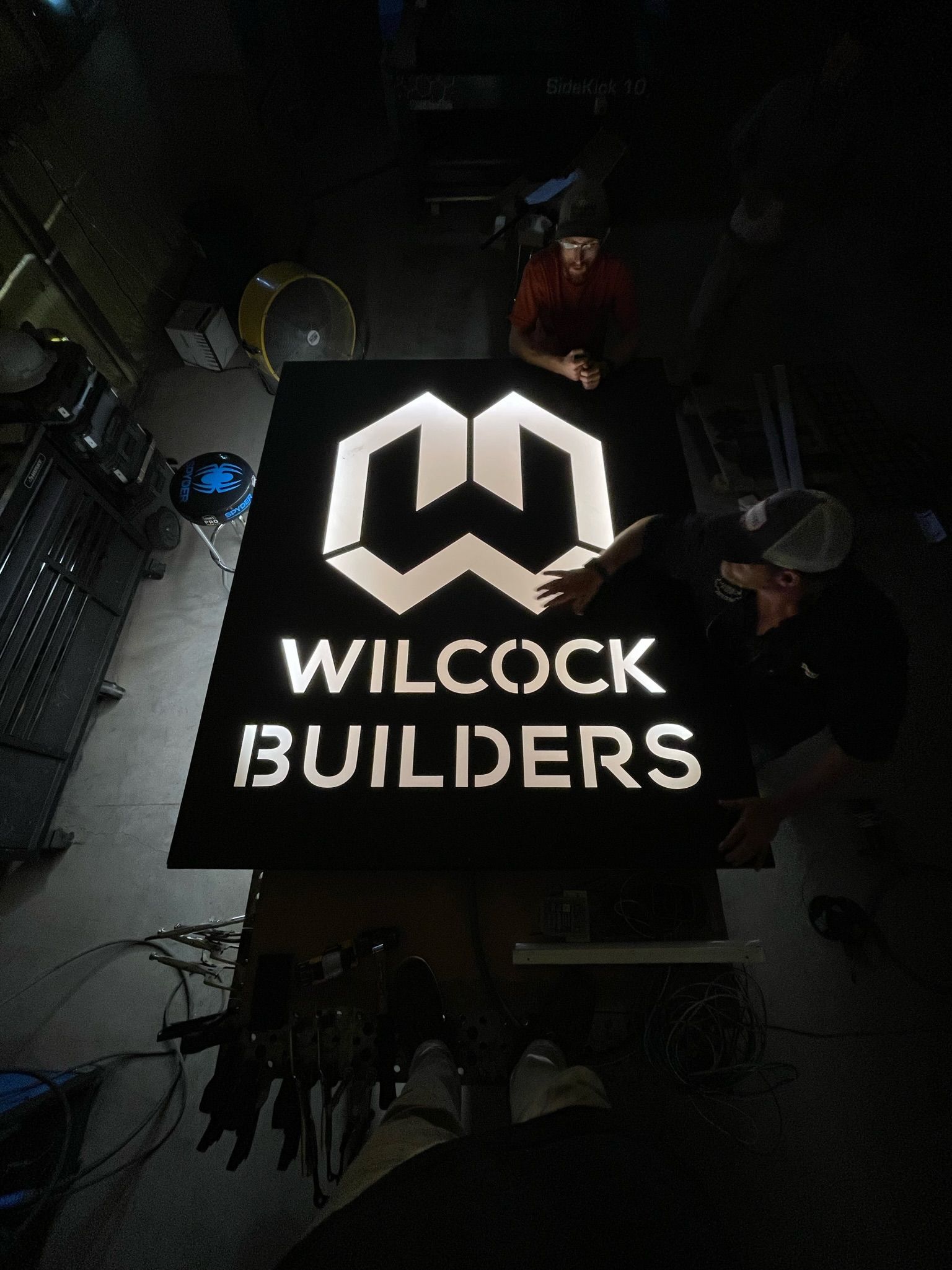 a sign that says Wilcock Builders on it