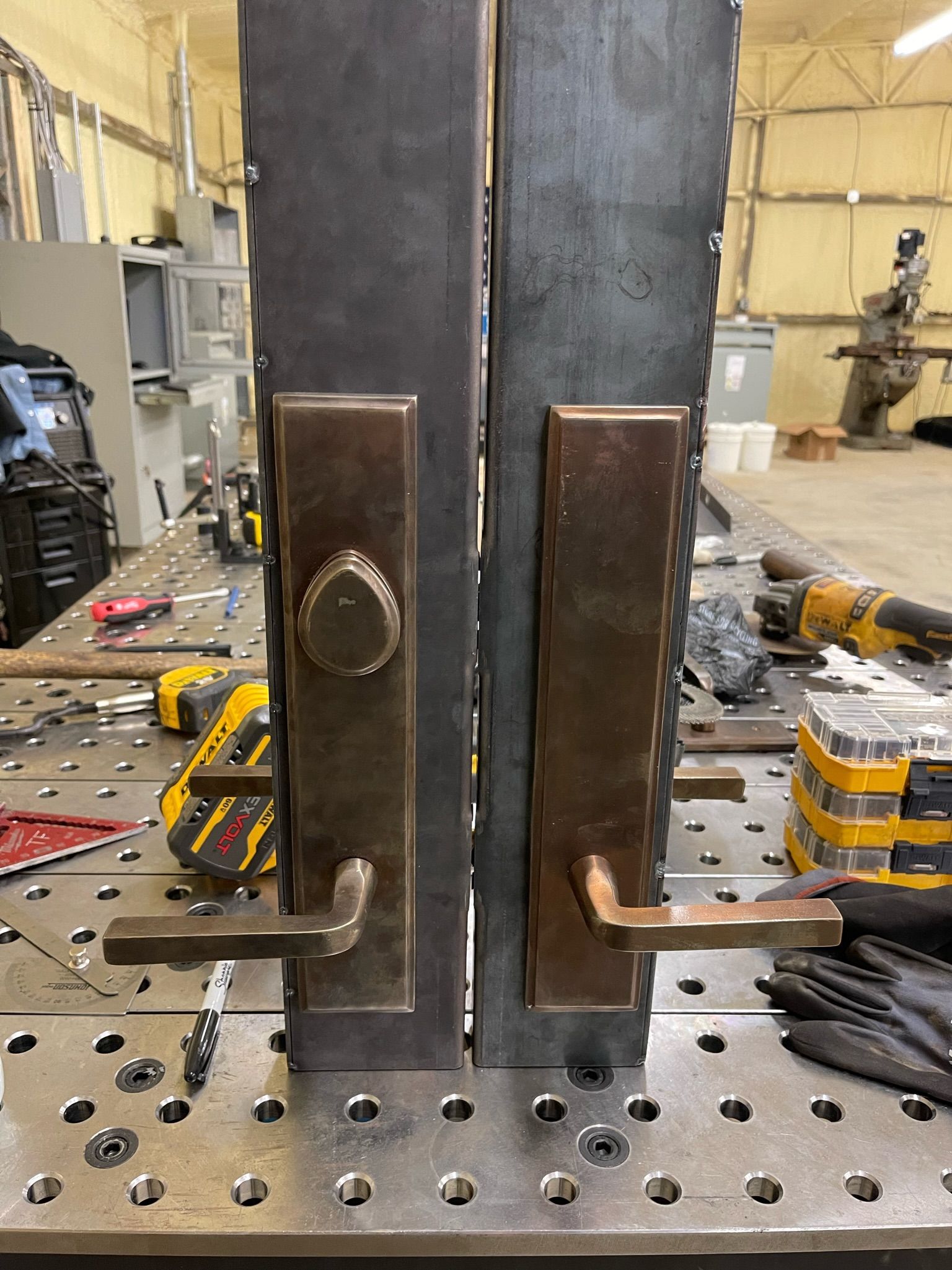 a pair of door locks are sitting on top of a metal table