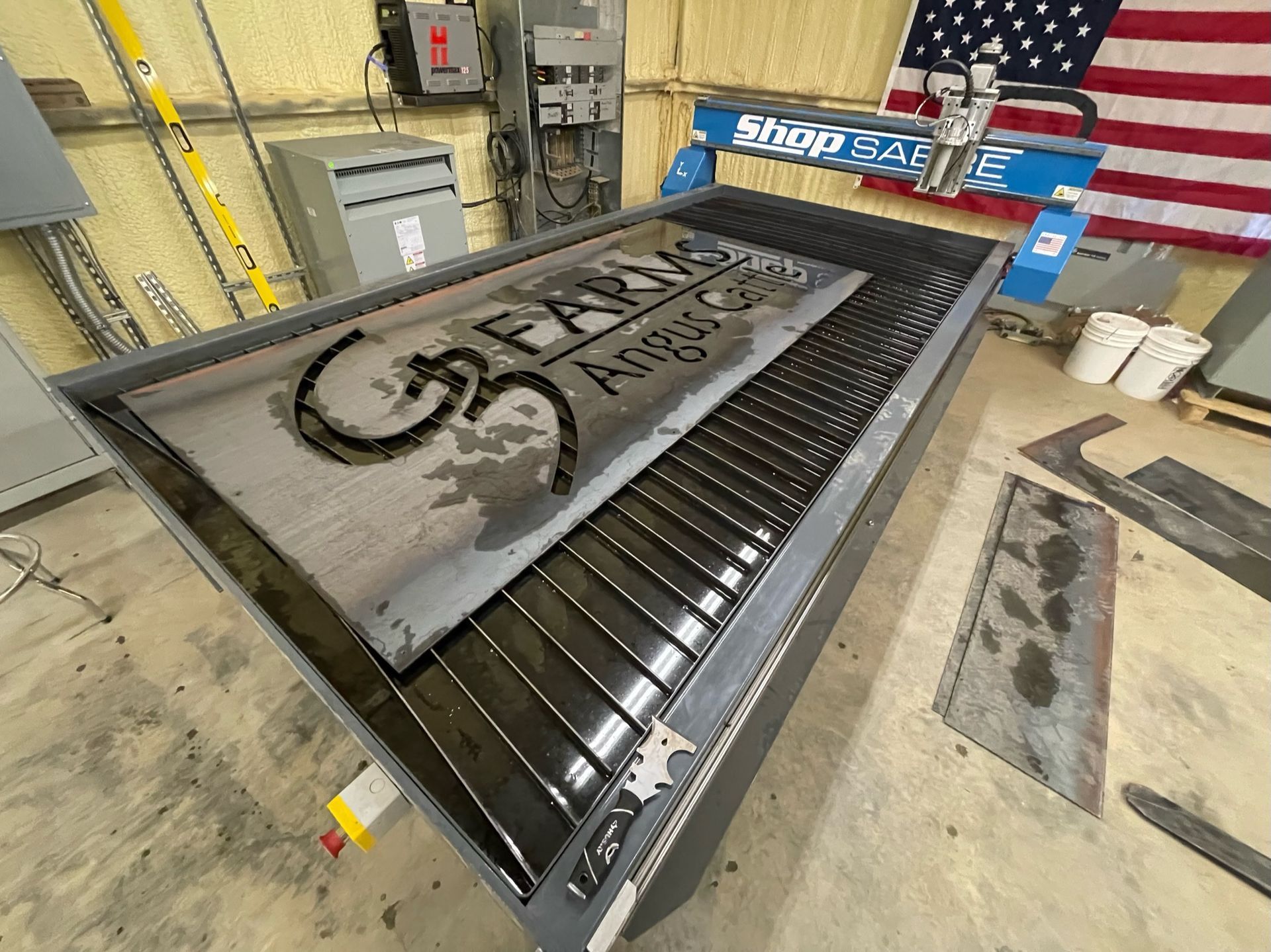 a large piece of metal is sitting on top of a machine