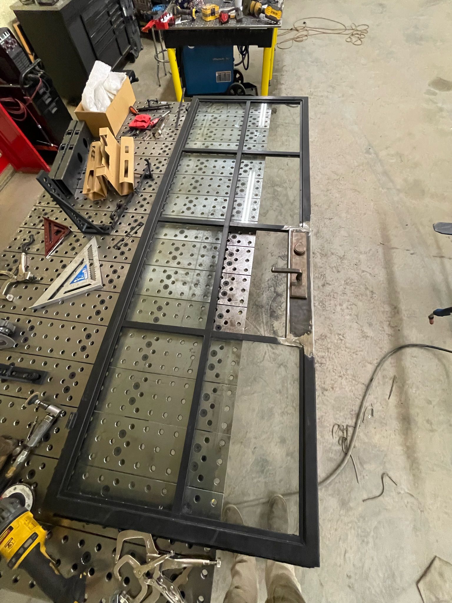 a large piece of glass is sitting on top of a table in a workshop