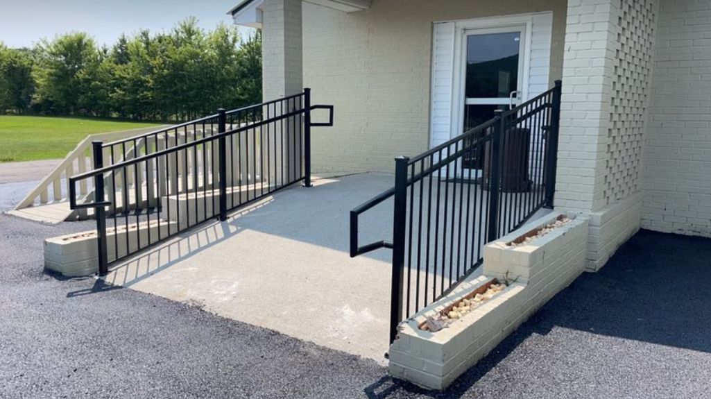 there is a ramp leading to the door of a building