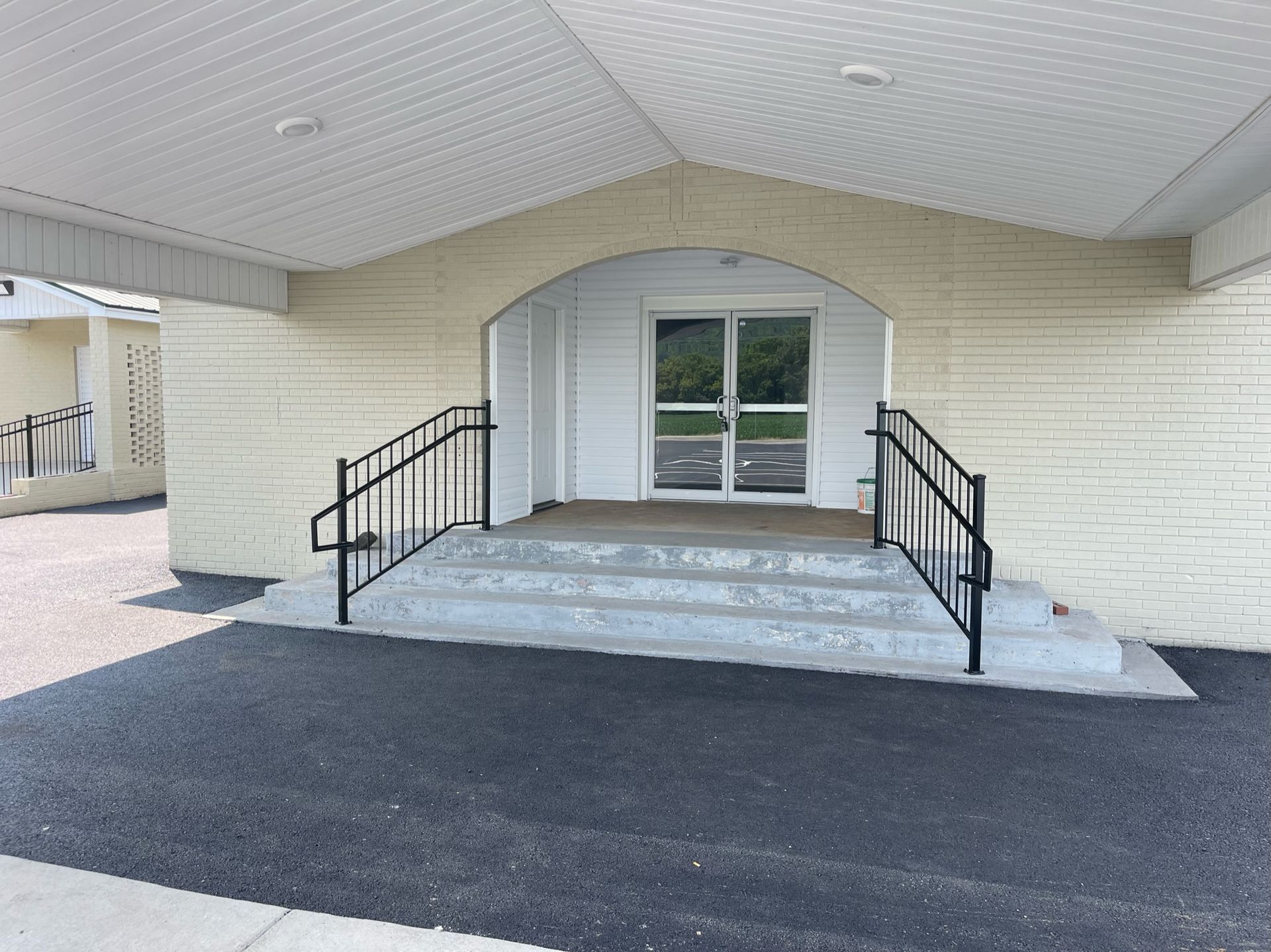 the entrance to a building with stairs leading up to it
