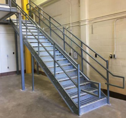 a metal staircase with a railing in a building