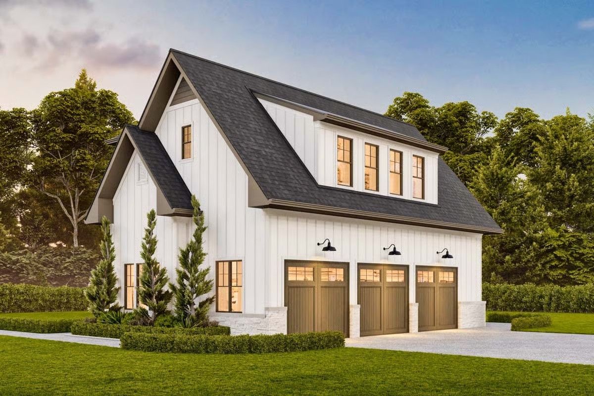 White barn-style garage with three bays and a dormer window; set in a grassy yard.
