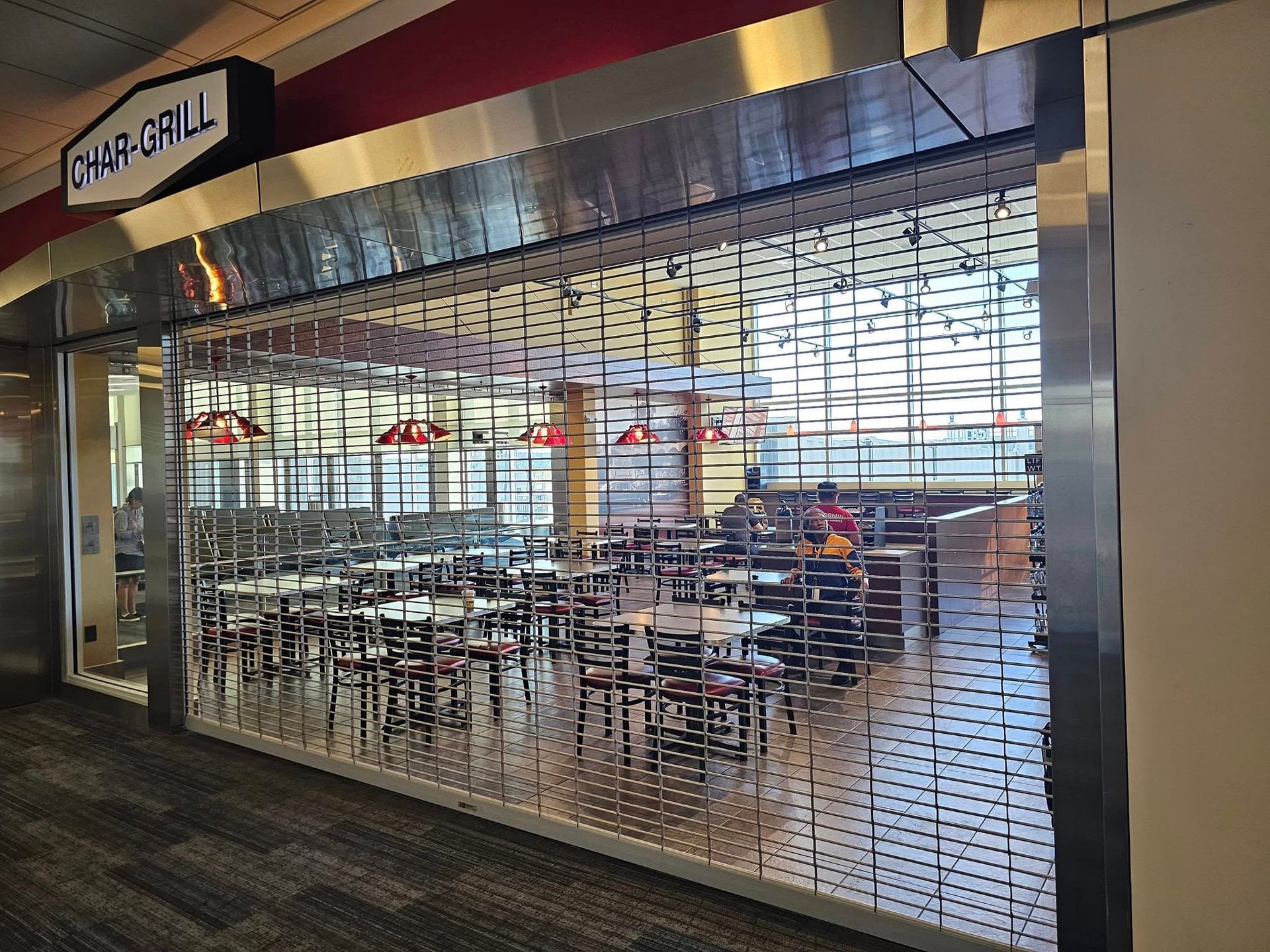 A restaurant with tables and chairs inside of it.