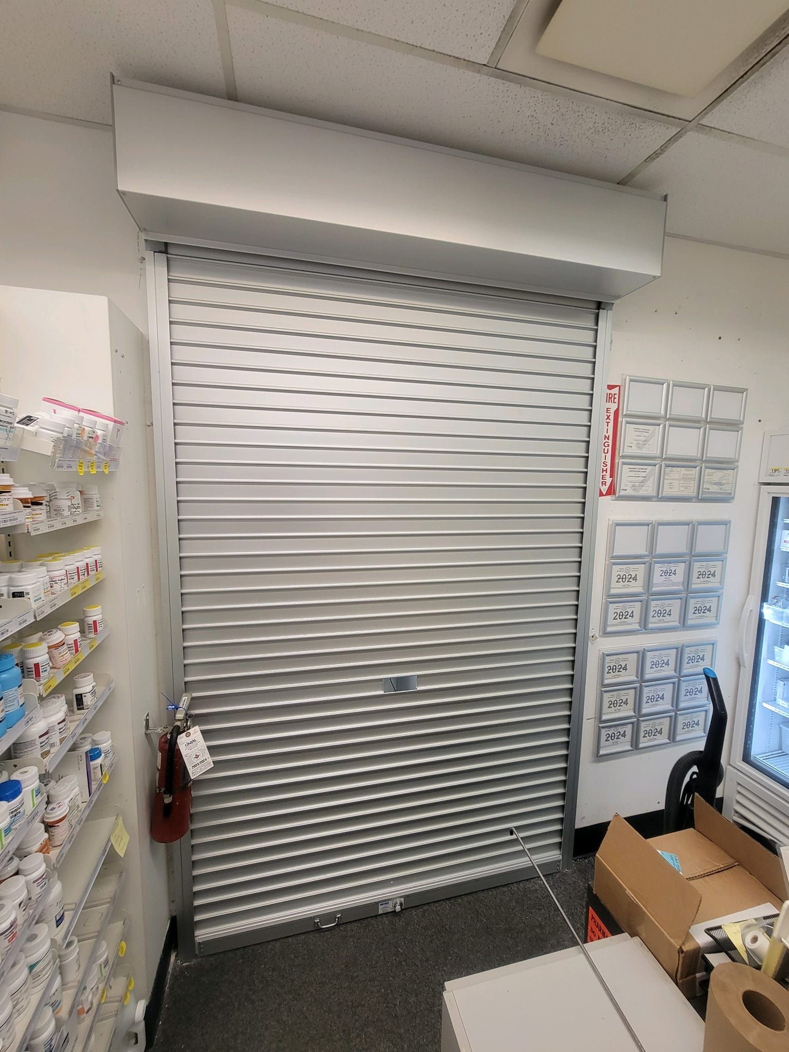 A store with a rolling shutter on the door.
