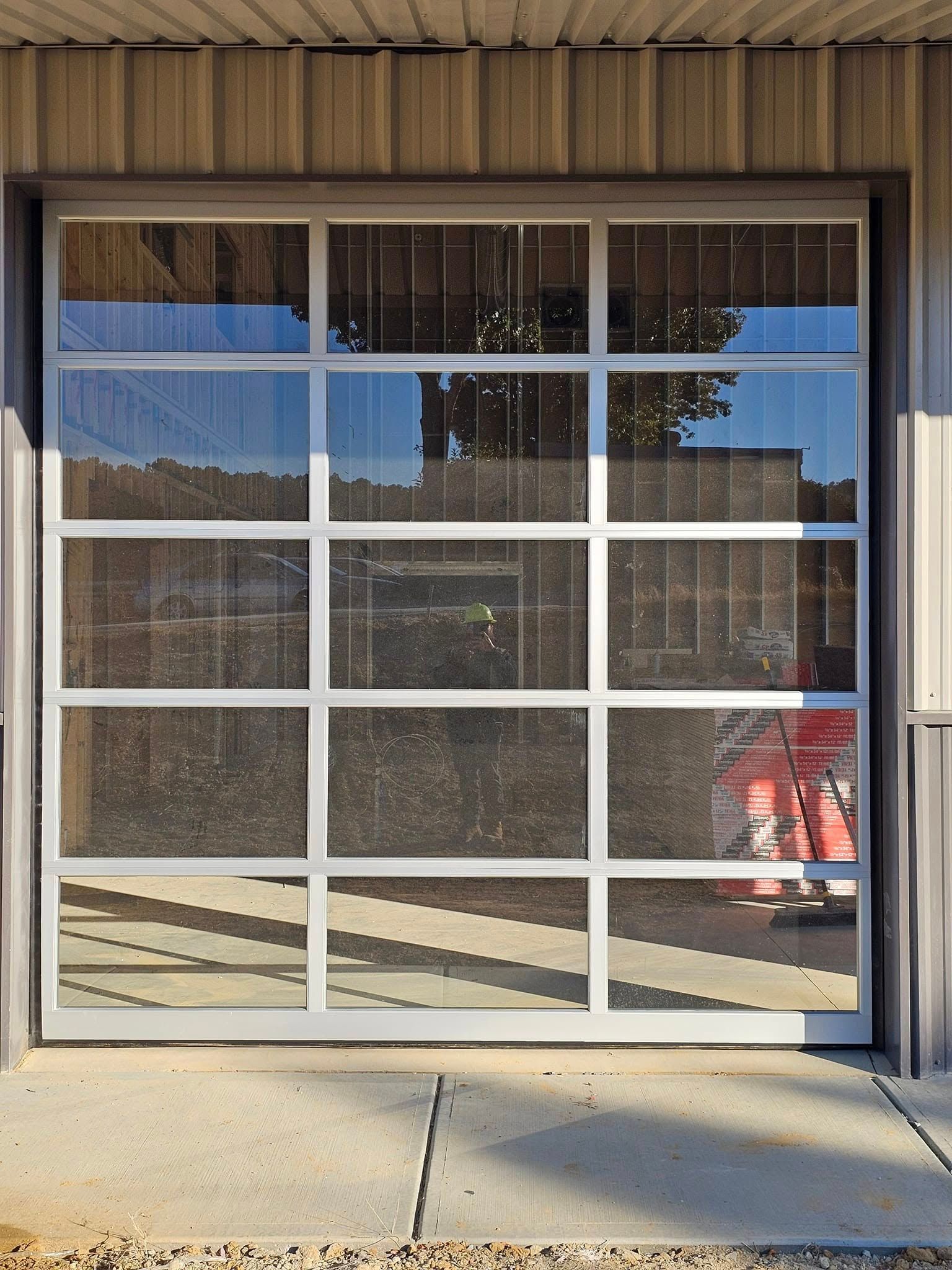 A garage door with a lot of glass on it