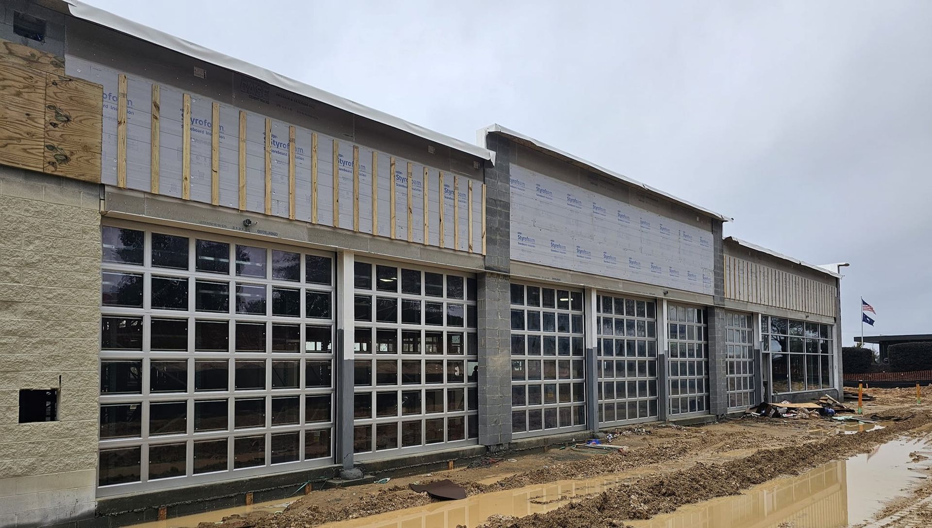 A large building under construction with a lot of windows.