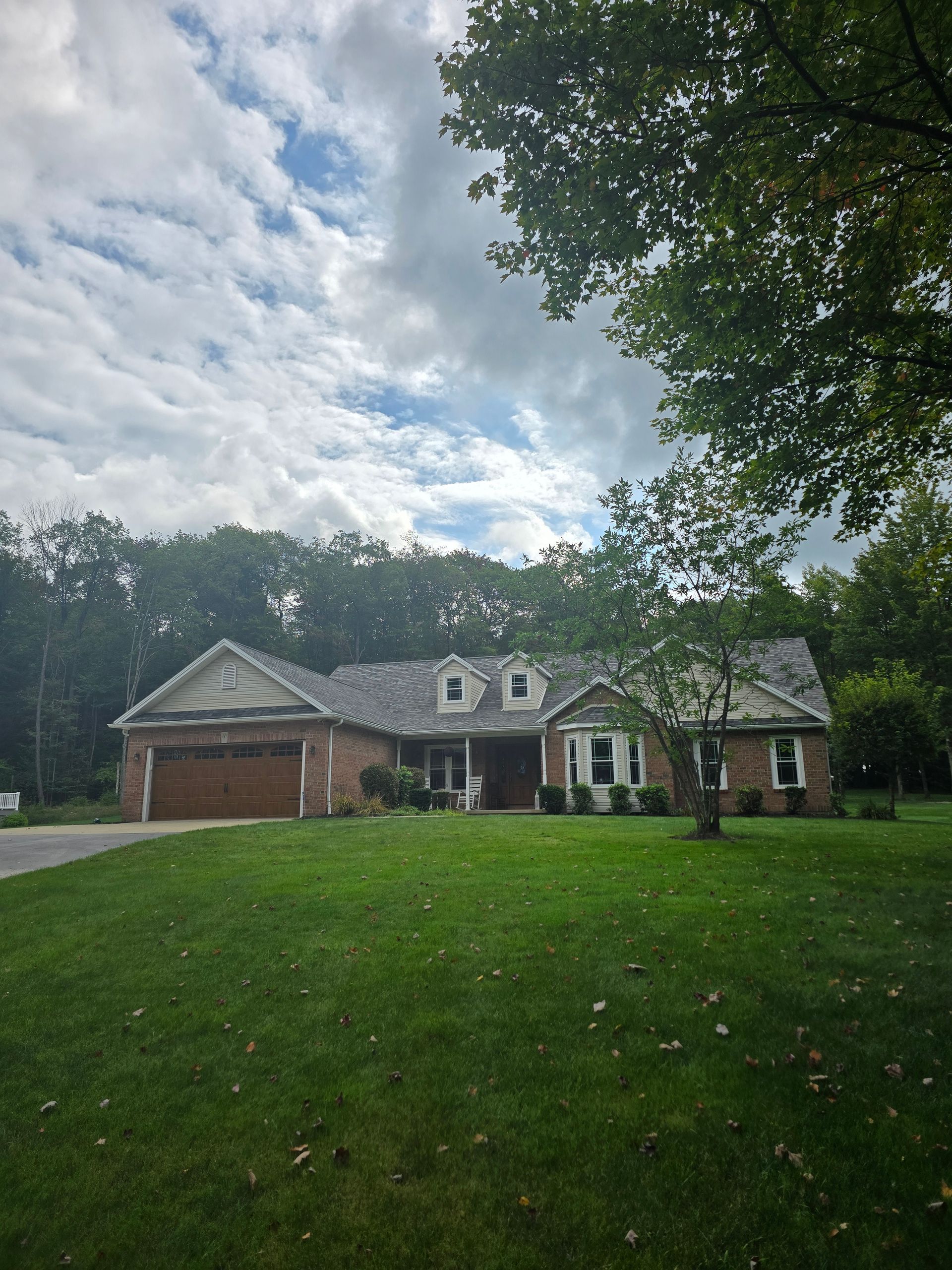 A large house with a large lawn in front of it