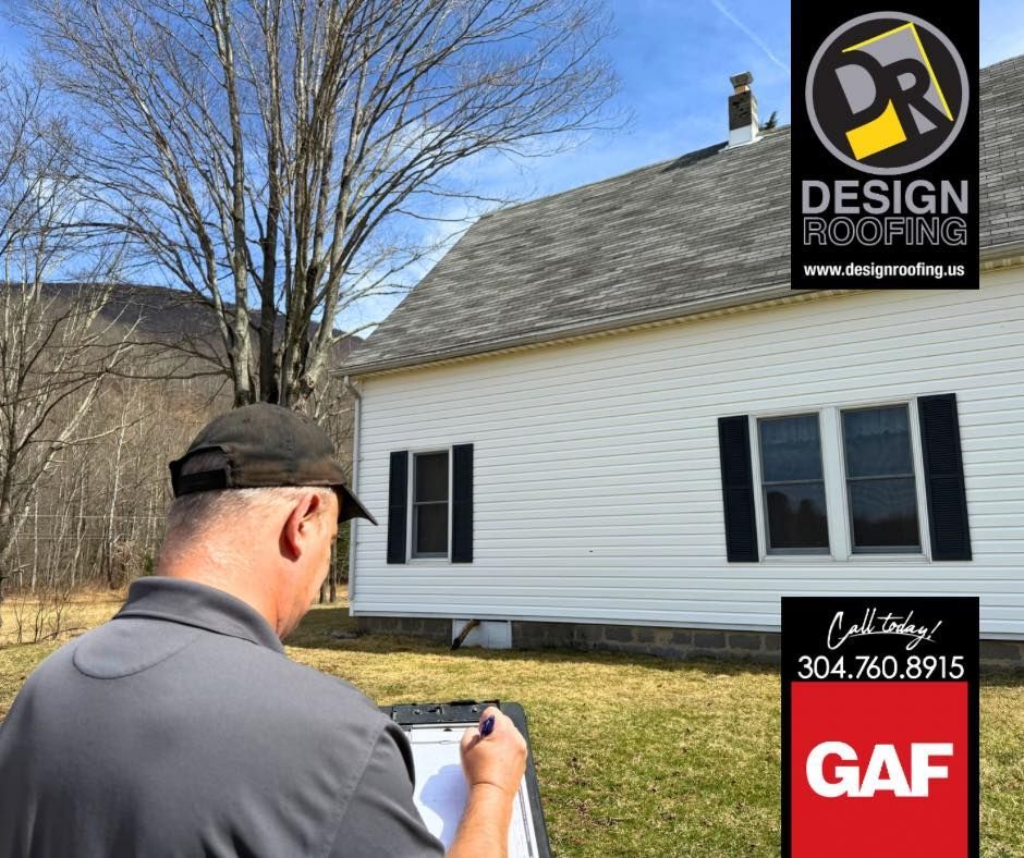 Man in cap taking notes on a clipboard, assessing a white house with gray roof; logo for Design Roofing and GAF.