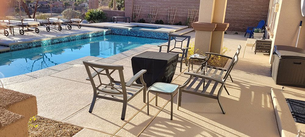 Beautiful pool deck with table and chairs