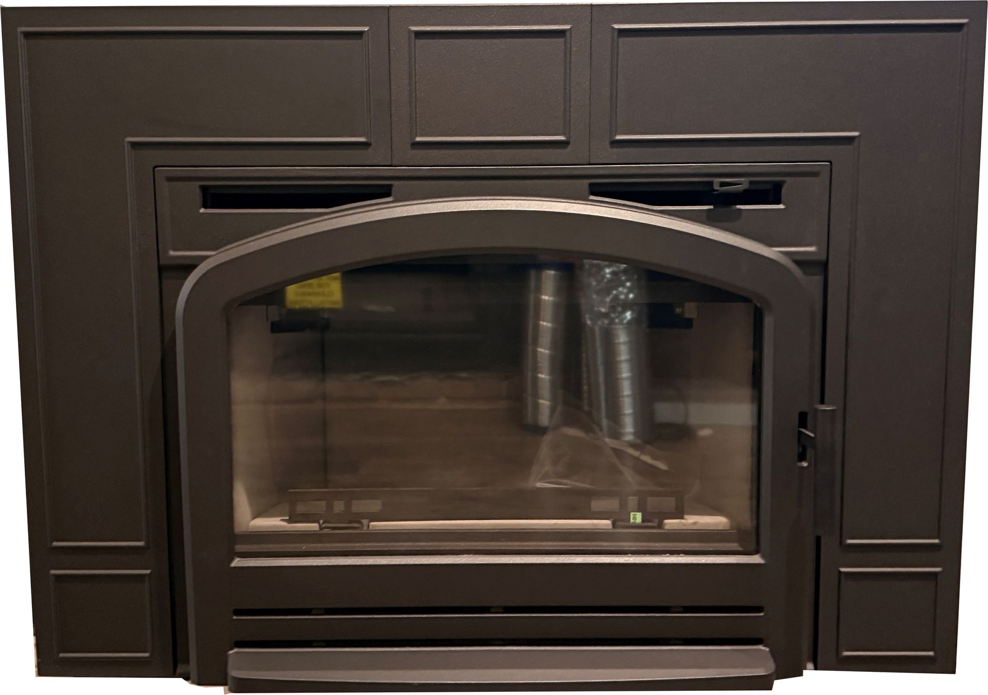 Dark wood fireplace with glass doors and matching paneled surround