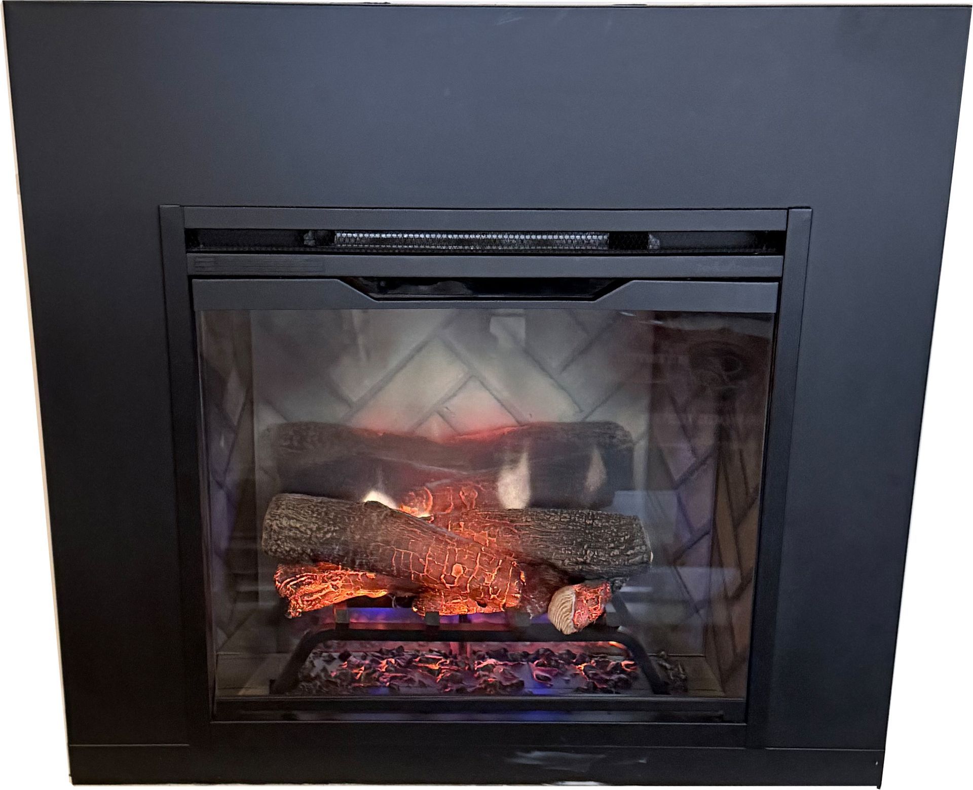 Lit gas fireplace with glowing logs and black frame in a dark wall.