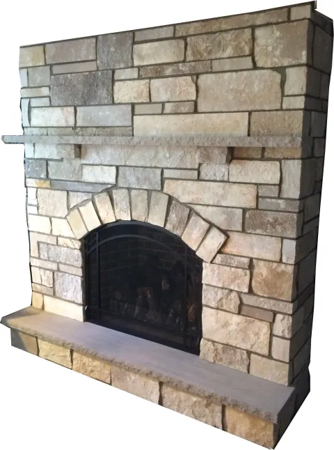 Stone fireplace with a dark arched opening, topped with a stone mantle and shelf.