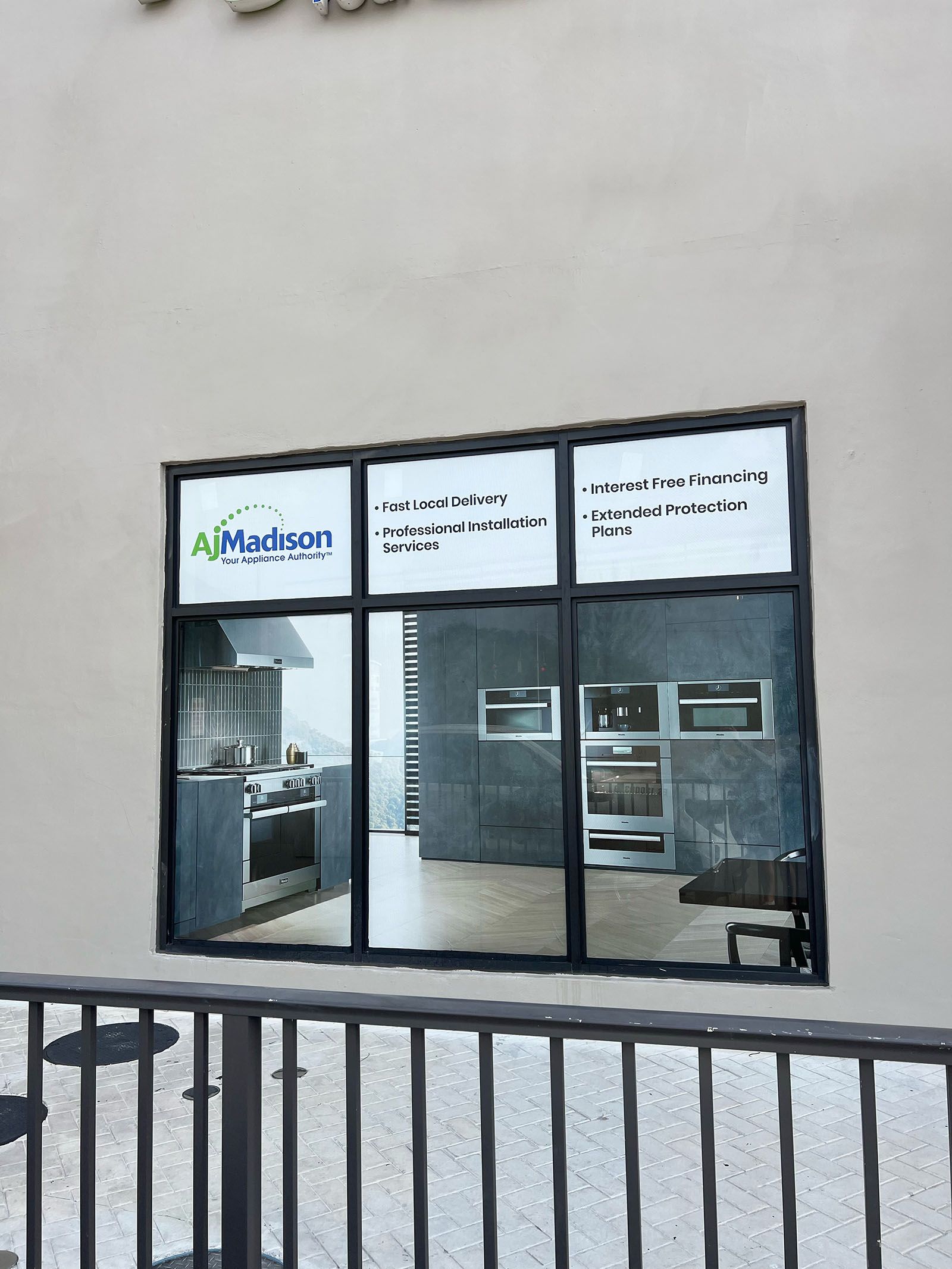 Artistic sticker signage on the glass panels