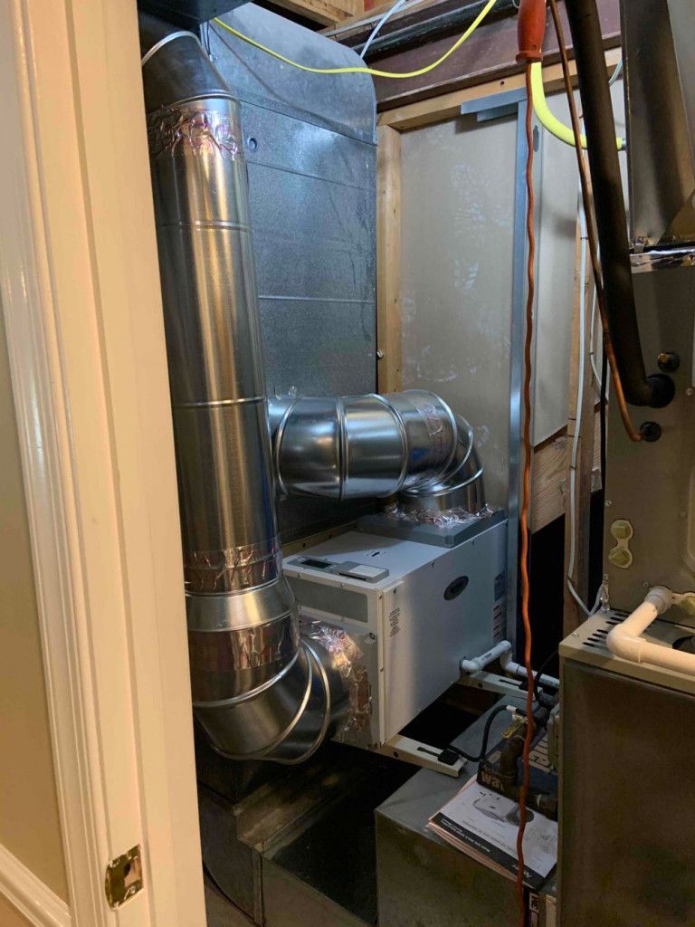 A picture of an air conditioner in a basement